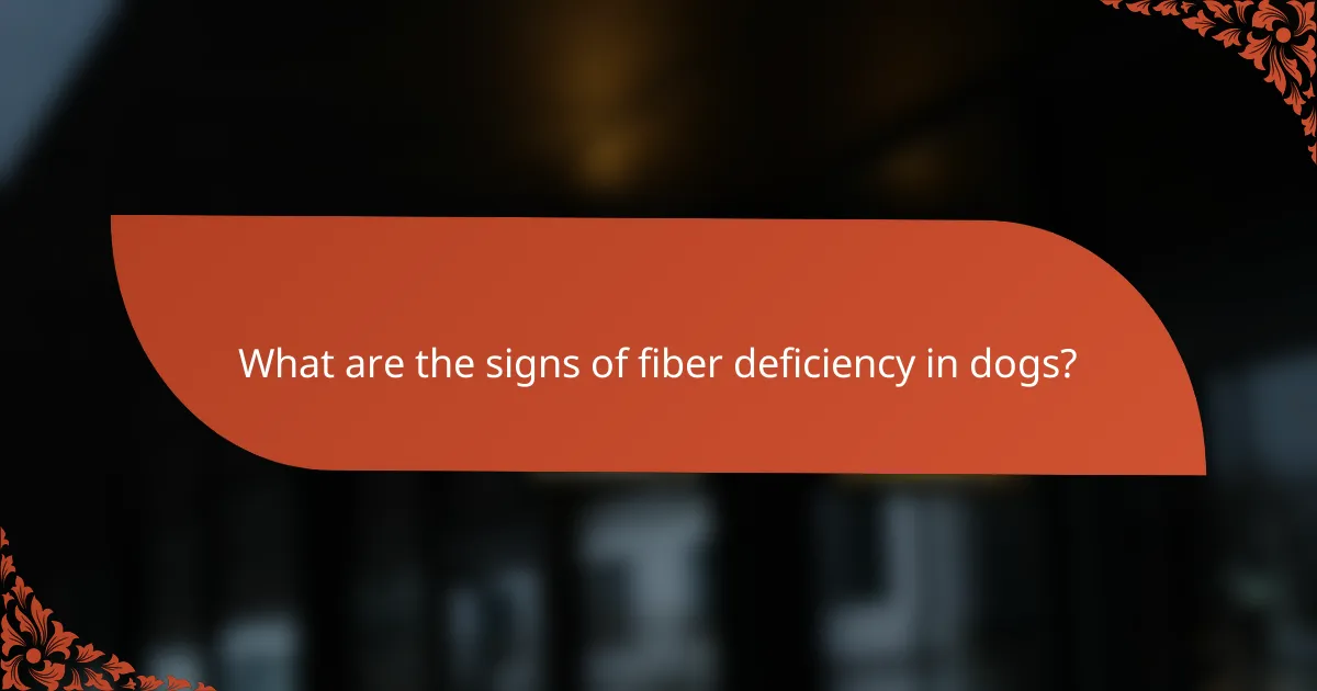 What are the signs of fiber deficiency in dogs?